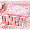A pink box of Cute Pink Series tape with 36 rolls displayed on a patterned fabric background.