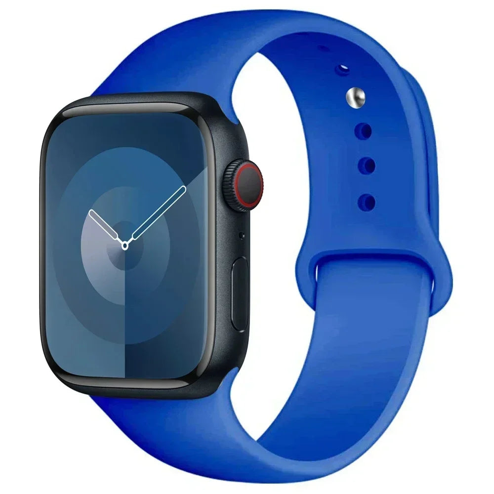 A blue silicone sport band worn around an Apple Watch.