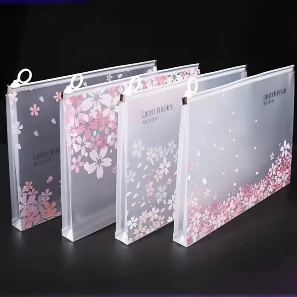 A set of transparent zipper file bags with pink cherry blossom designs for storing documents.
