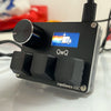A black magnetic rapid trigger keyboard switch device labeled QwQ, featuring a blue display and a silver body.