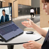 A woman is using an adjustable laptop cooling pad with a multi-fan technology while working on a laptop.