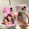 A hand holds a pink iPhone in a clear case with 3D cat ears for shockproof protection.
