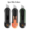 Three mini pocket knives in different colors black orange and green with silver blades