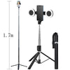 A black extendable phone tripod with an LED ring light and mirror mounted on a vertical stand.