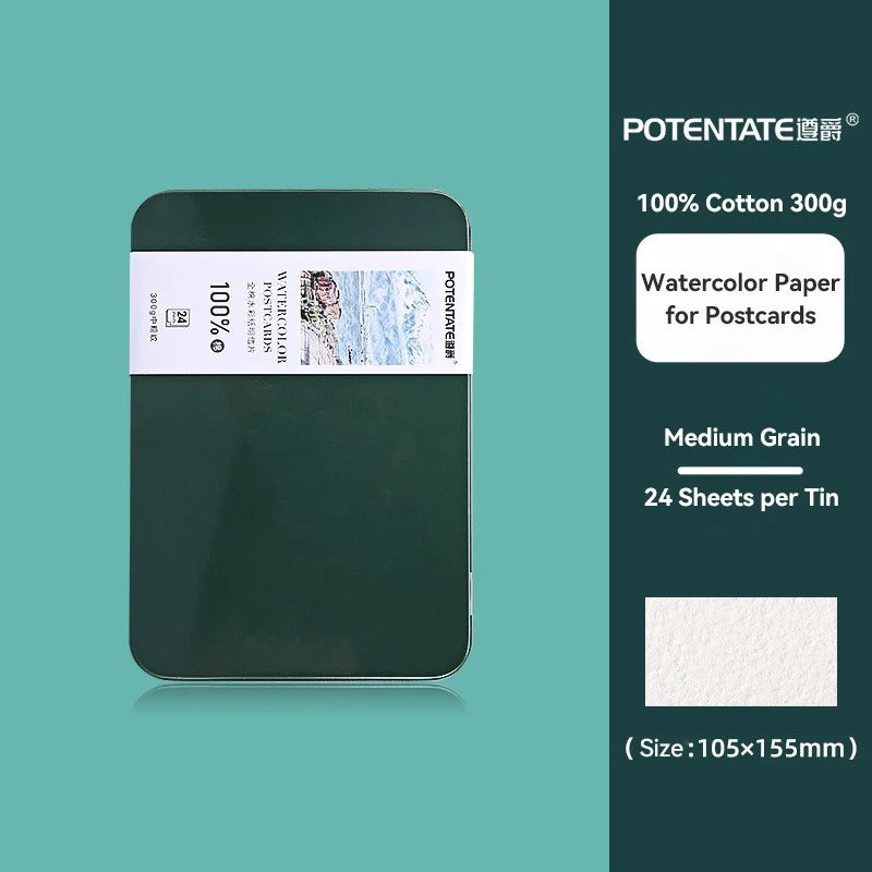 A green tin of 100% cotton watercolor paper for postcards with a label indicating medium grain and 24 sheets per tin.
