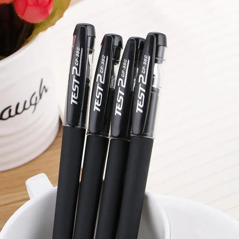 A bulk pack of black gel ink pens is shown standing upright on a white surface.