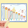 A hand holds a yellow retractable teacher pointer stick with various multiplication problems written on a grid background.
