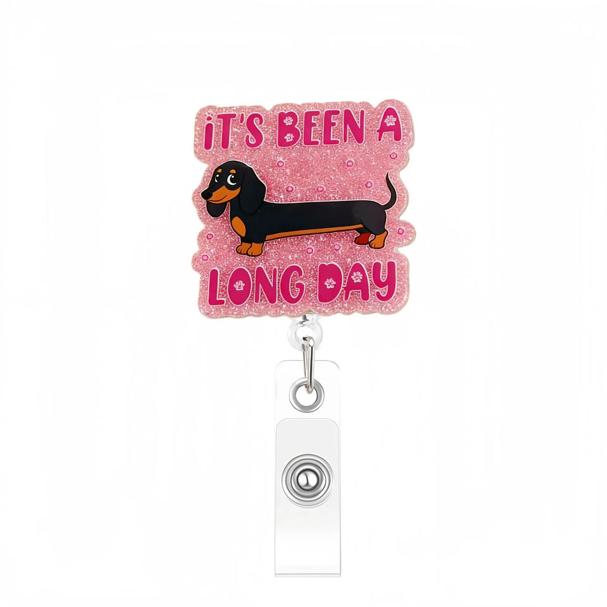Pink acrylic badge reel with a silhouette of a dog saying It's been a long day