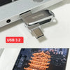 A metallic SanDisk Ultra Dual Drive flash drive is shown next to a Type-C smartphone.