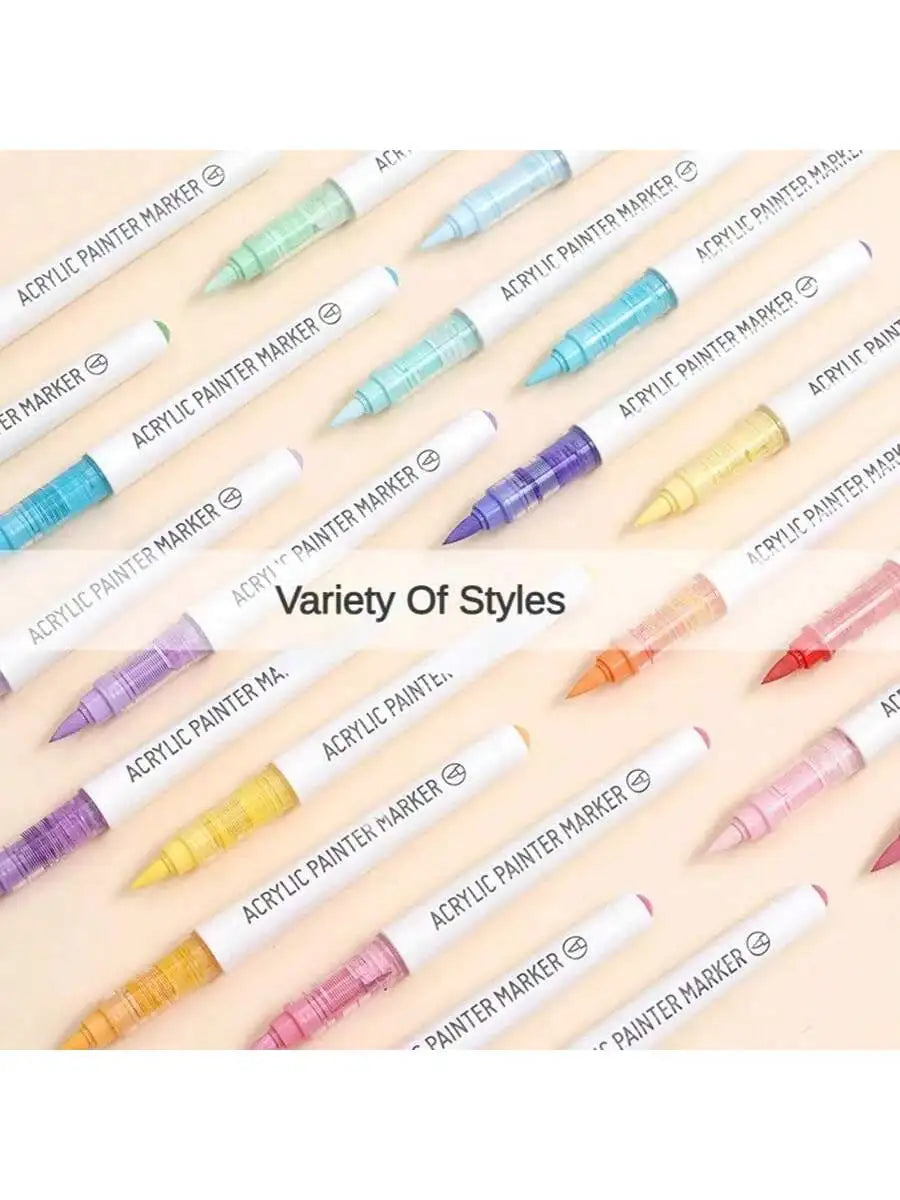 A variety of soft acrylic paint markers in various colors and tips are displayed on a white background.