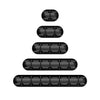 A set of black silicone cable organizers and winders stacked vertically.