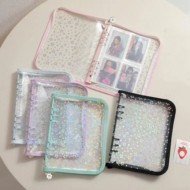 A transparent zipper photo binder with multiple clear plastic pages and a pink and green colored cover.
