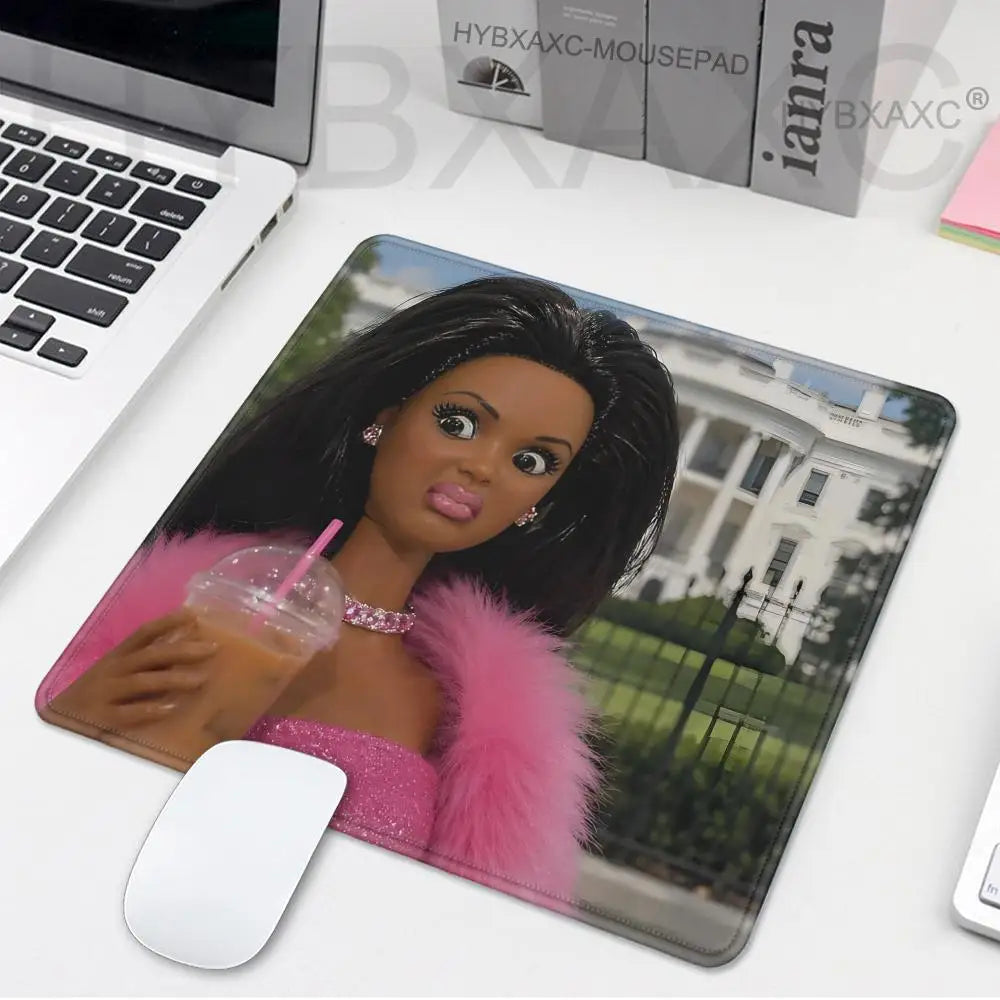 A playful doll face design on a mouse pad featuring a woman with dark hair and pink fur accents.