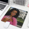 A playful doll face design on a mouse pad featuring a woman with dark hair and pink fur accents.