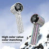 A silver handheld cooling fan with a black grille and iridescent color matching is shown against a snowy background.