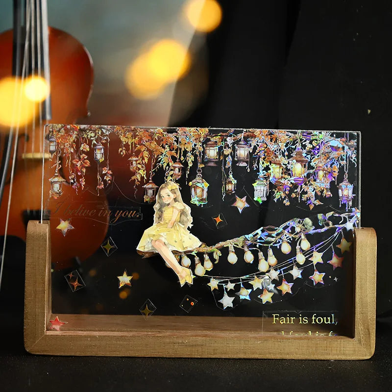A decorative PET washi tape roll featuring a golden-hued scene with stars and foliage.