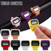 A collection of various colored thumb counter digital clickers shown on a dark surface.