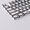 A close-up view of a set of black PBT keycaps with translucent lettering and various function keys like ESC, Tab, Shift, and 
