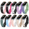 A collection of 10 silicone watch bands with various colors and floral engravings for Xiaomi smart bands.