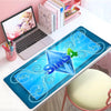 A blue gaming mouse pad for The Sims featuring a diamond design and stitched edges placed on a white desk.