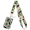 A patterned fabric lanyard featuring black cats and green foliage for a card holder.