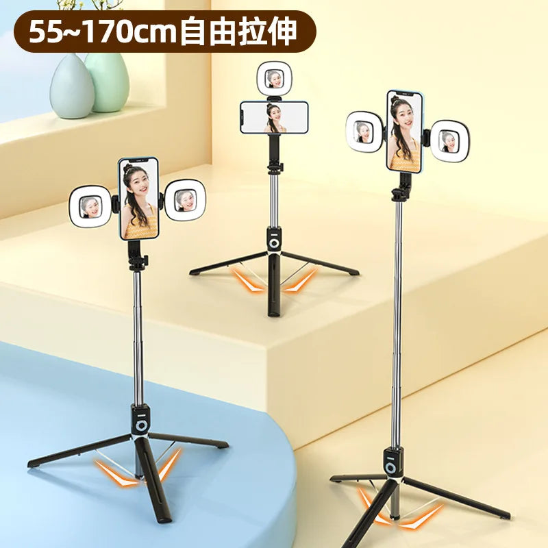 A set of 4 extendable phone tripods with LED ring lights and mirrors shown on a light background.