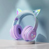 Light purple gradient headphones with cat ear accents resting on a white stand.