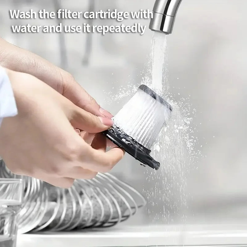 A hand is washing a white filter cartridge with water under a faucet.