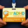 A yellow awareness card for a person with ADHD attached to a blue lanyard, showing a brain silhouette.