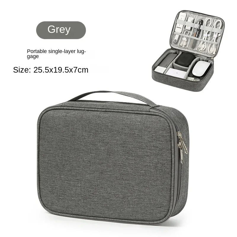 A grey portable single-layer lug-gage travel cable organizer bag with a lid showing various electronic accessories.