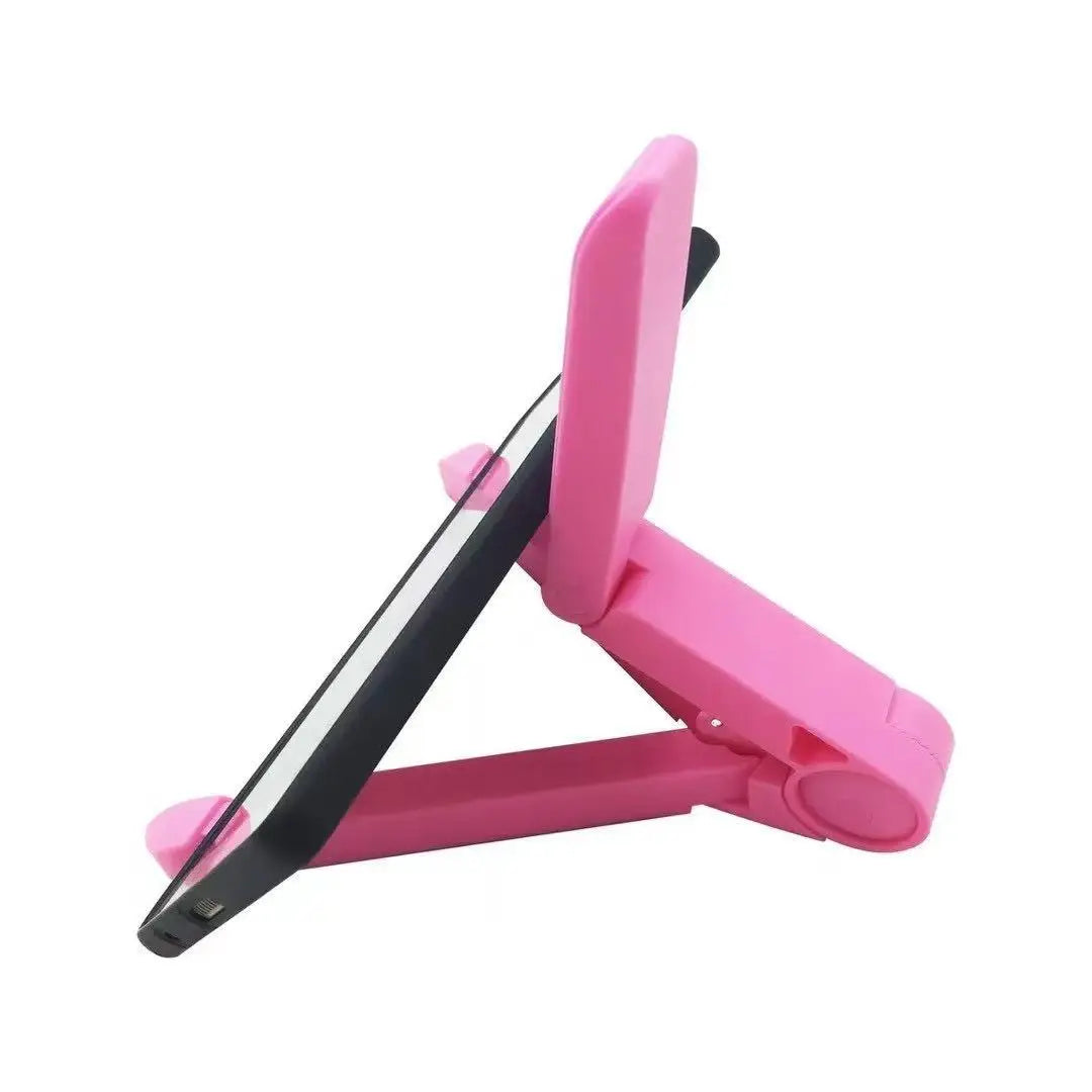 A pink foldable adjustable tablet stand designed to hold devices like iPads and phones.