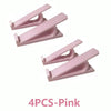 Set of four pink adjustable keyboard tray risers for ergonomic typing
