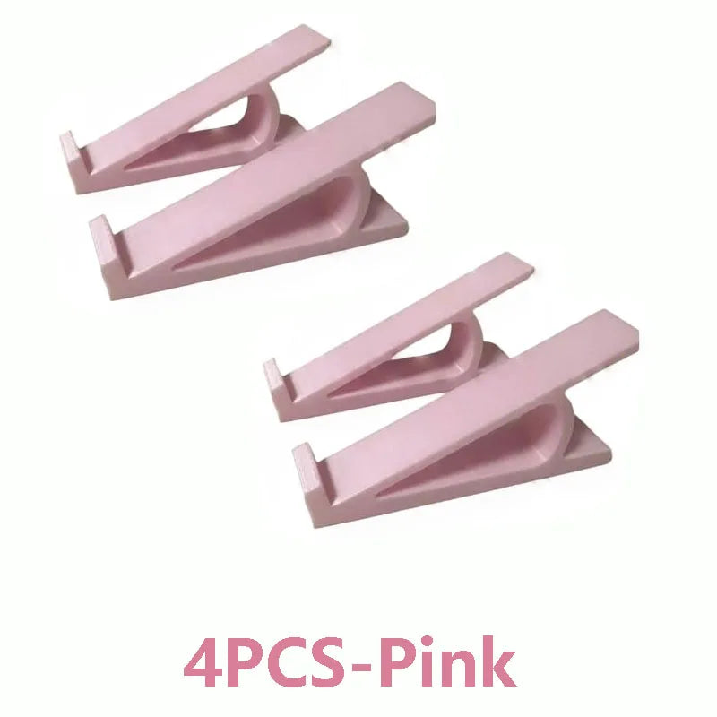 Set of four pink adjustable keyboard tray risers for ergonomic typing