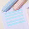 Two gradient double-sided tape pens in light blue and pink are shown on a white sheet of paper.