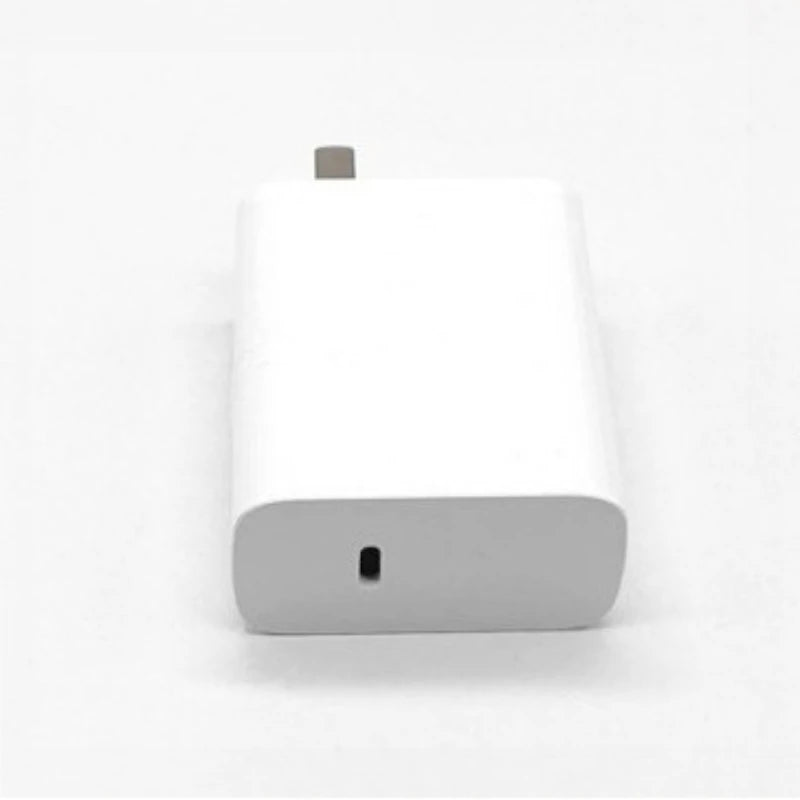 A white secret storage charger plug for valuables with a small metal tip.
