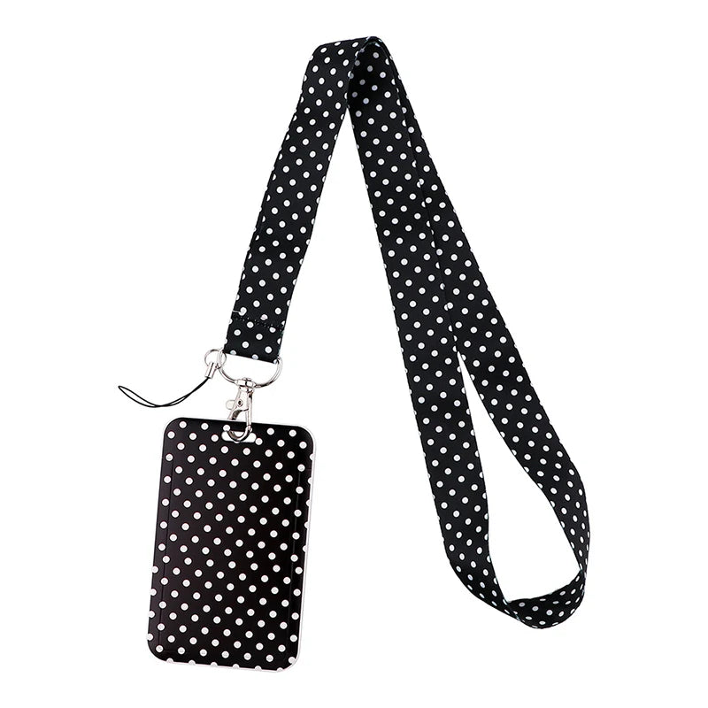 Black lanyard with white polka dots for holding ID badges and accessories