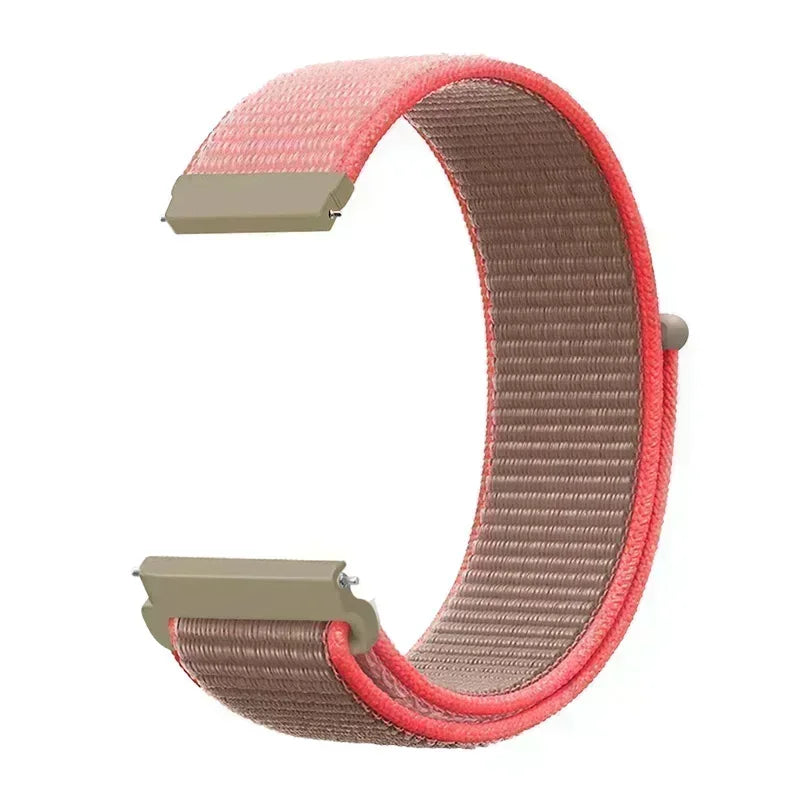 A close-up view of a pink and beige nylon loop watch strap for a child's watch.