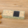 A set of vintage wooden stamp seals featuring letters, numbers, and symbols arranged in a rectangular box.