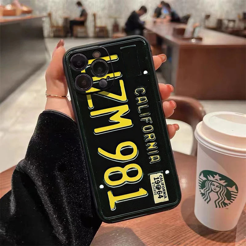 A black phone case shaped like a vintage California license plate with the text 1861 and the year 1964