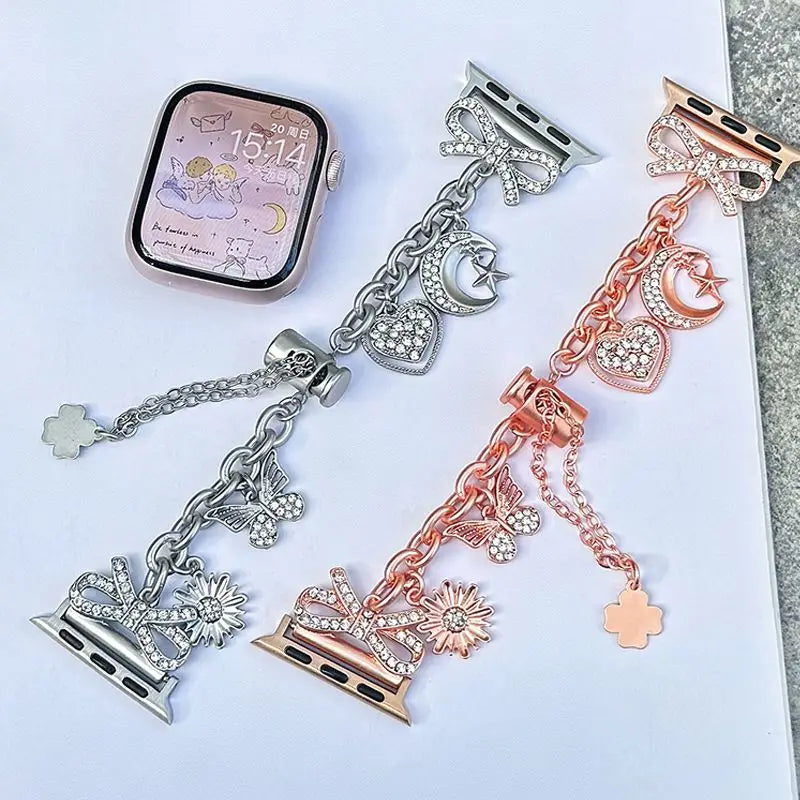 A set of fashionable diamond butterfly watch straps and a watch face displayed on a white background.