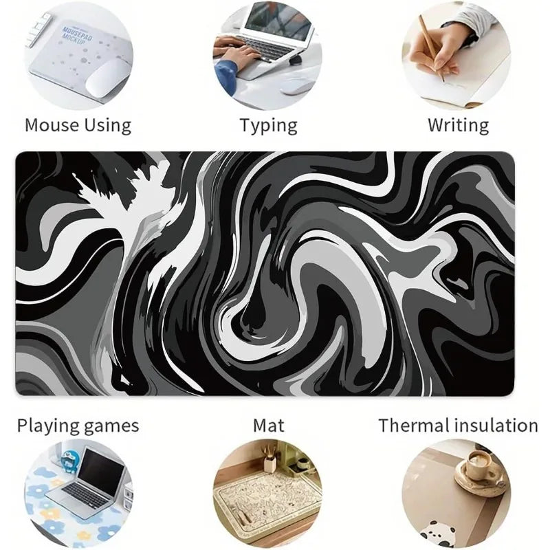 Large gaming mouse pad featuring a black and white liquid wave design used for typing, writing, and thermal insulation.