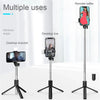 A portable extendable Bluetooth selfie stick with a fill light mounted on a tripod for various uses.