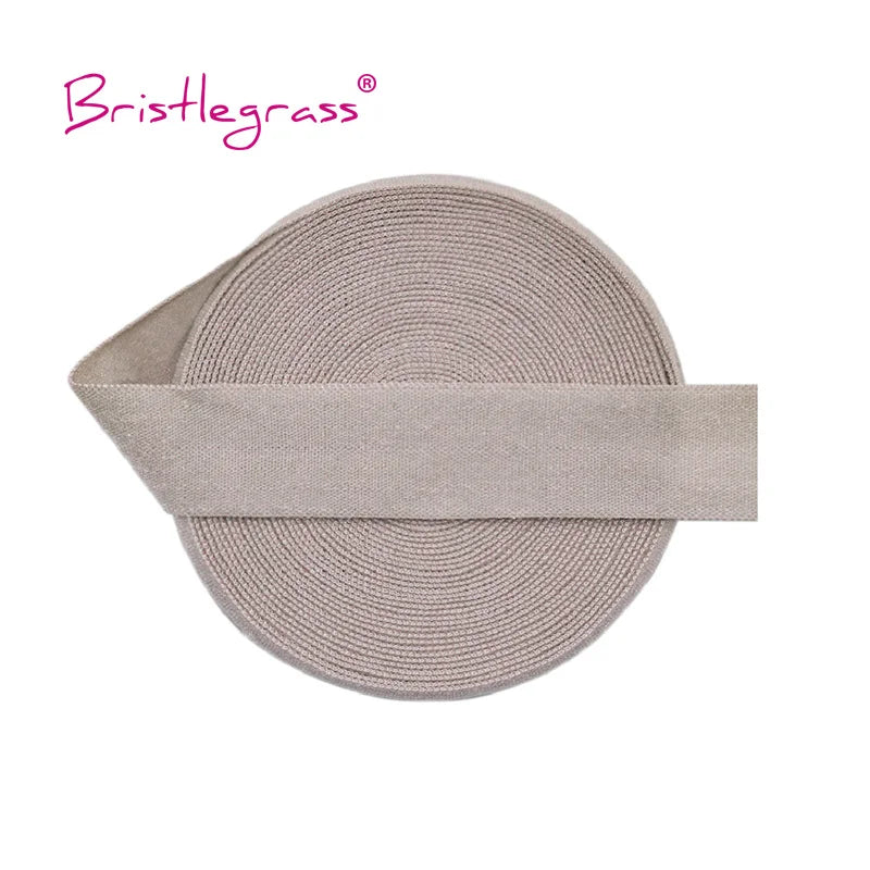 A beige adjustable spandex elastic hair tie with a flat band and textured surface.