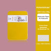 A yellow tin of 100% cotton watercolor paper for postcards with a label indicating 24 sheets per tin.