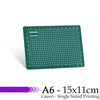 A green A6 cutting mat with a grid for cutting mats, featuring single-sided printing.