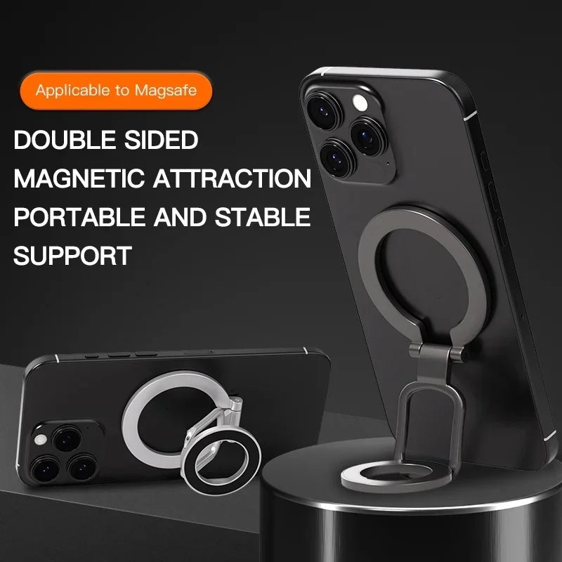 A black smartphone is held in a portable and stable stand using double-sided magnetic attraction.