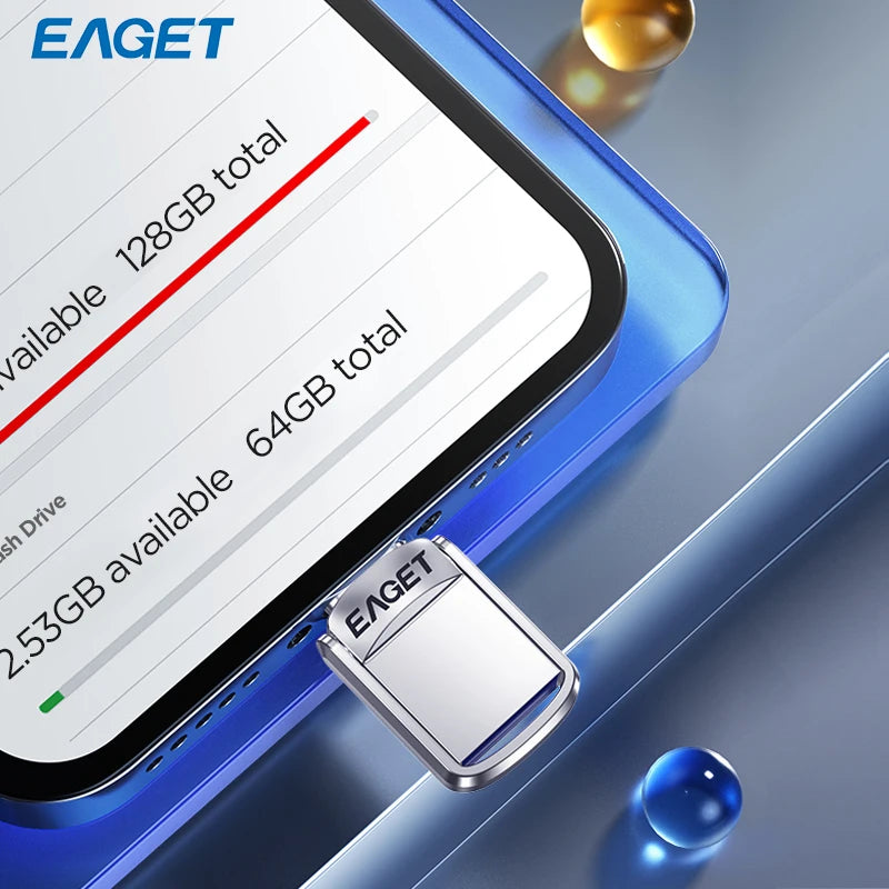 A silver metal flash drive is shown next to a smartphone displaying storage capacity information.