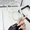 A hand holds a clear silicone case for a Samsung Galaxy Z Fold phone with a magnetic hinge protection feature.