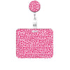 A pink leopard print retractable badge holder with a circular clip.