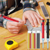 Hands hold a red mechanical pencil with a built-in sharpener and various pencil tips on a wooden surface.